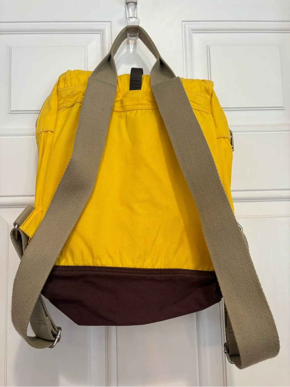 TOMS Citrus Waxed Canvas Trekker Backpack with Brown Base and Roll-Top Closure